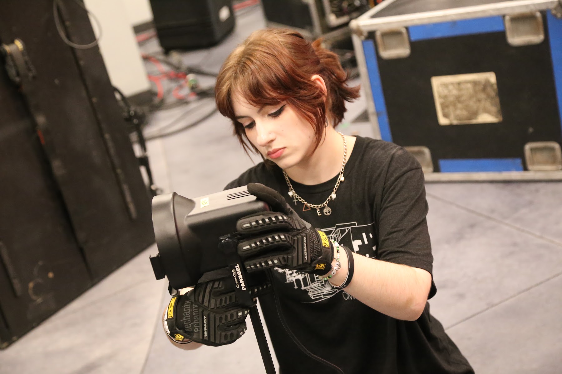 Student operating a broadcast camera