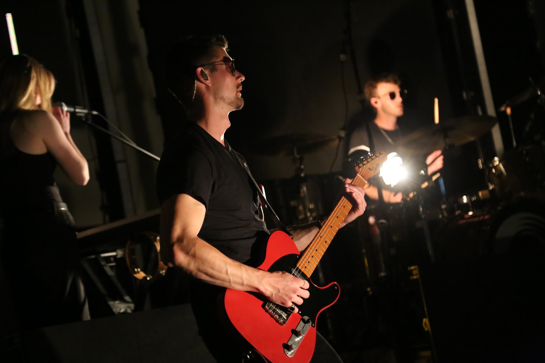 Student band performing with a red guitar