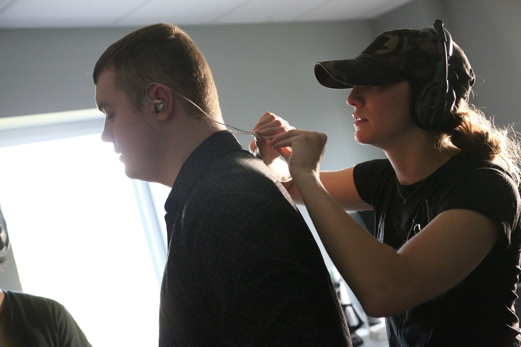 Two students on headsets running a show